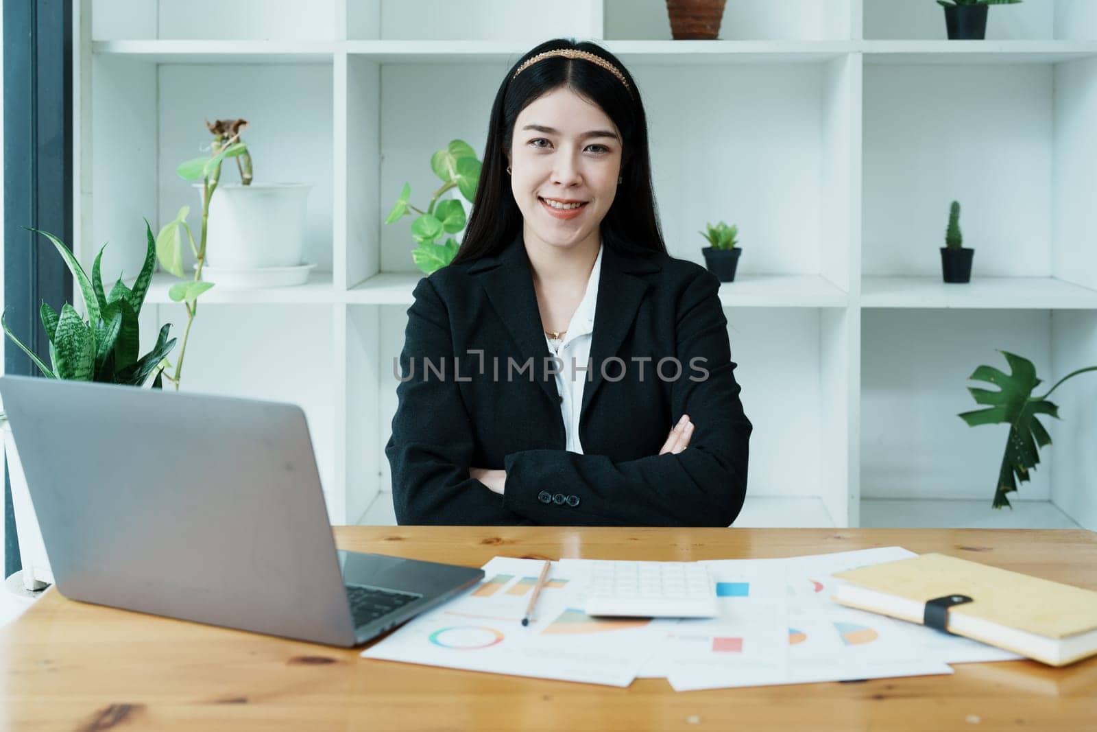 financial, Planning, Marketing and Accounting, portrait of Asian employee checking financial statements using documents and calculators at work..