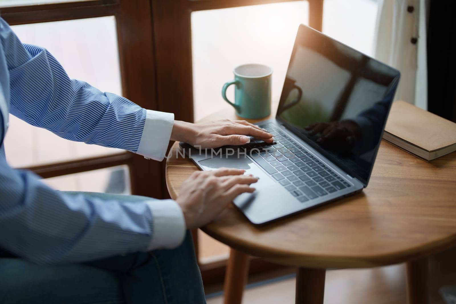 Portrait of a beautiful Asian teenage girl using a computer by Manastrong