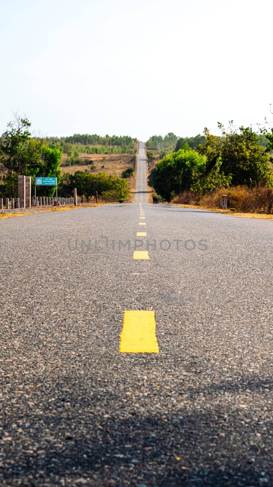Photo for Affirmation about goal and right way. Never Stop Motivational. Beautiful view of empty asphalt road yellow line mountain nature.