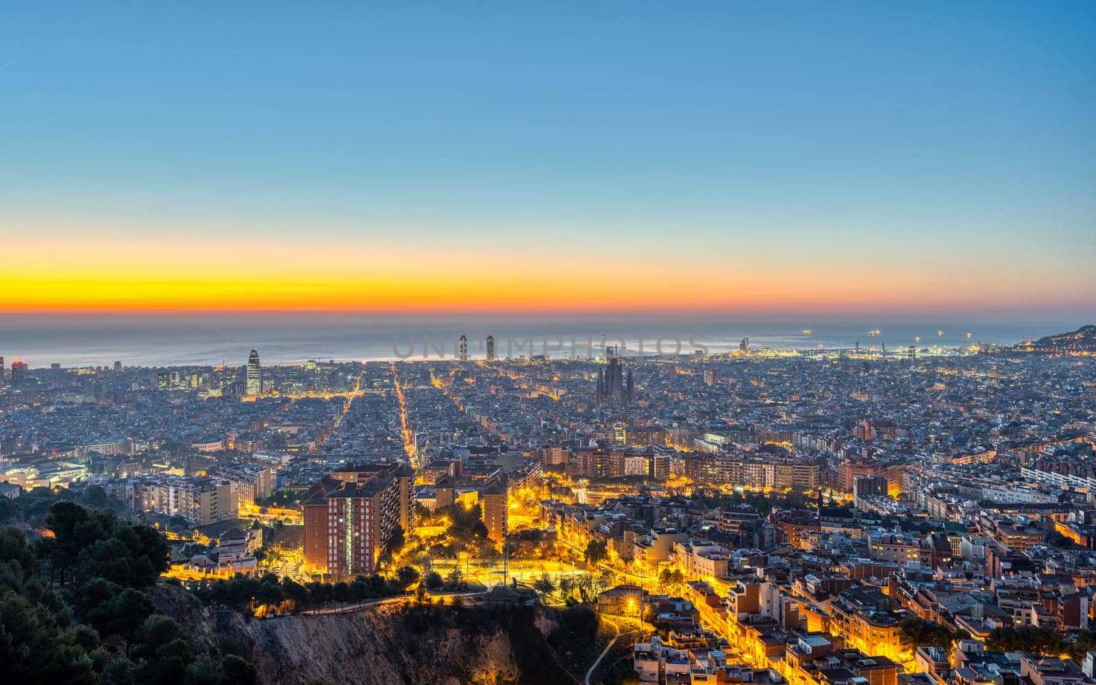 The skyline of Barcelona with the Mediterranean Sea by elxeneize