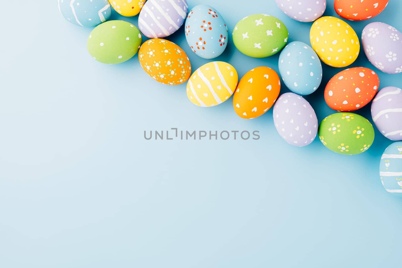 Colorful easter eggs isolated on blue background by Sorapop