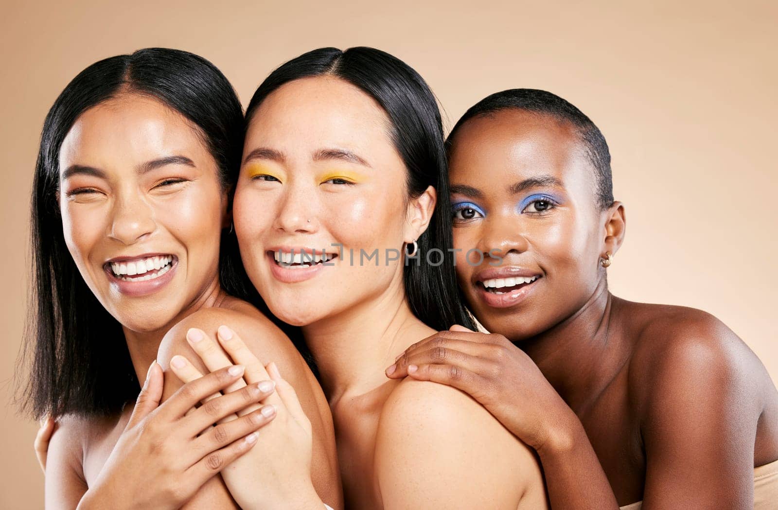 Makeup, diversity and woman happiness together for support, facial wellness and cosmetics dermatology care in brown background studio. Model, smile and interracial beauty inclusion with skin glow.