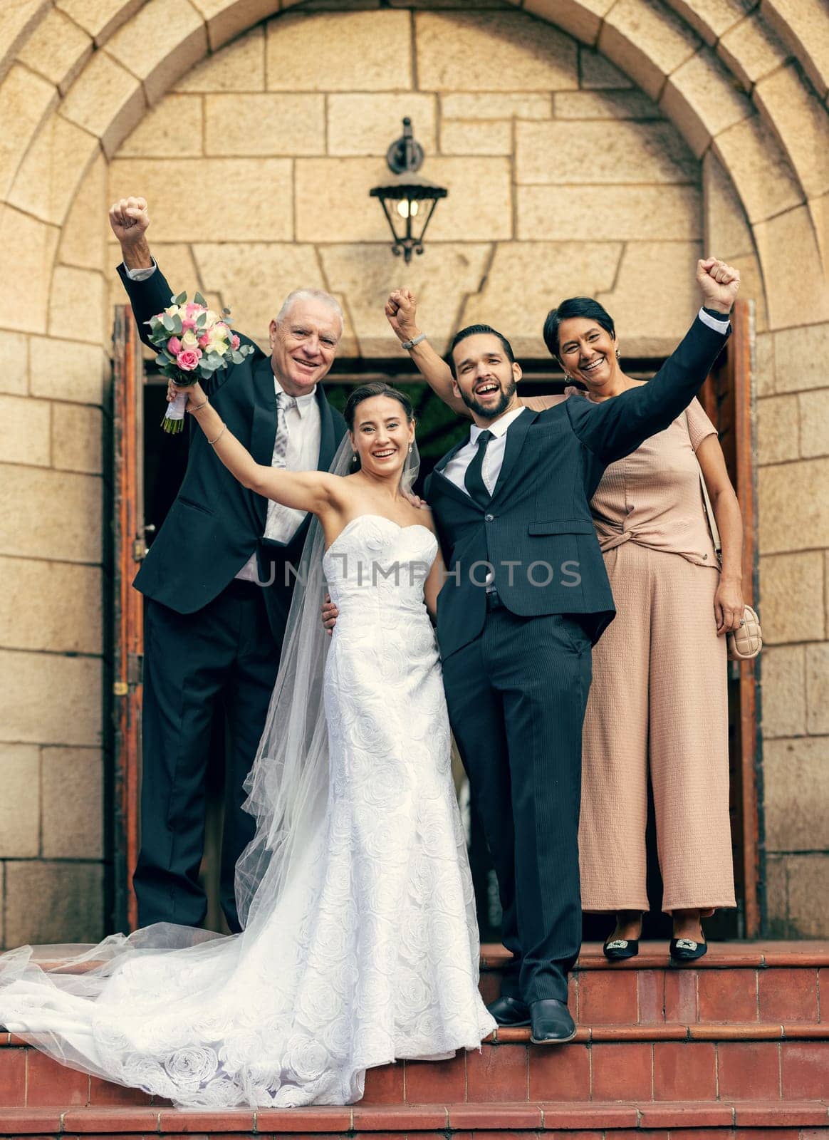 Wedding, bride and groom with parents on stairs, church and happiness at excited celebration. Marriage, couple and celebrate with flowers, portrait and happy family for love with mom, dad and outdoor by YuriArcurs