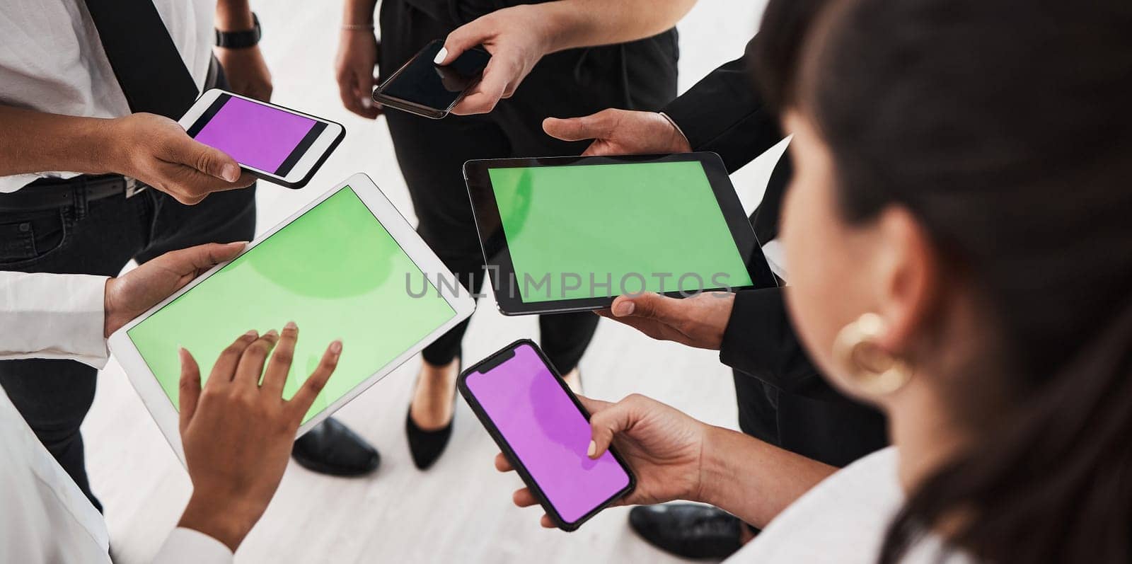 Hands, green screen and technology with a business group in studio isolated on a white background for communication or networking. Tablet, phone and mockup with an employee team on blank space by YuriArcurs