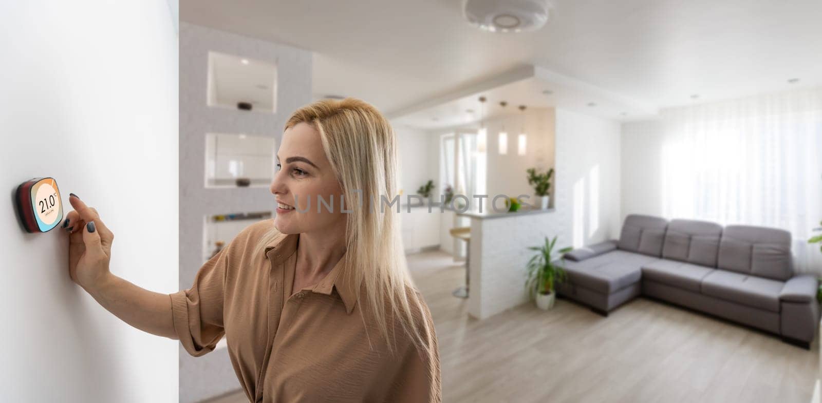 Woman pressing on smart home automation panel monitor.