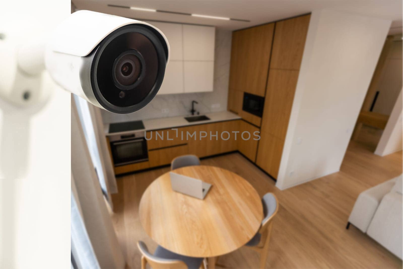 Modern CCTV camera installed in entryway of apartment building by Andelov13