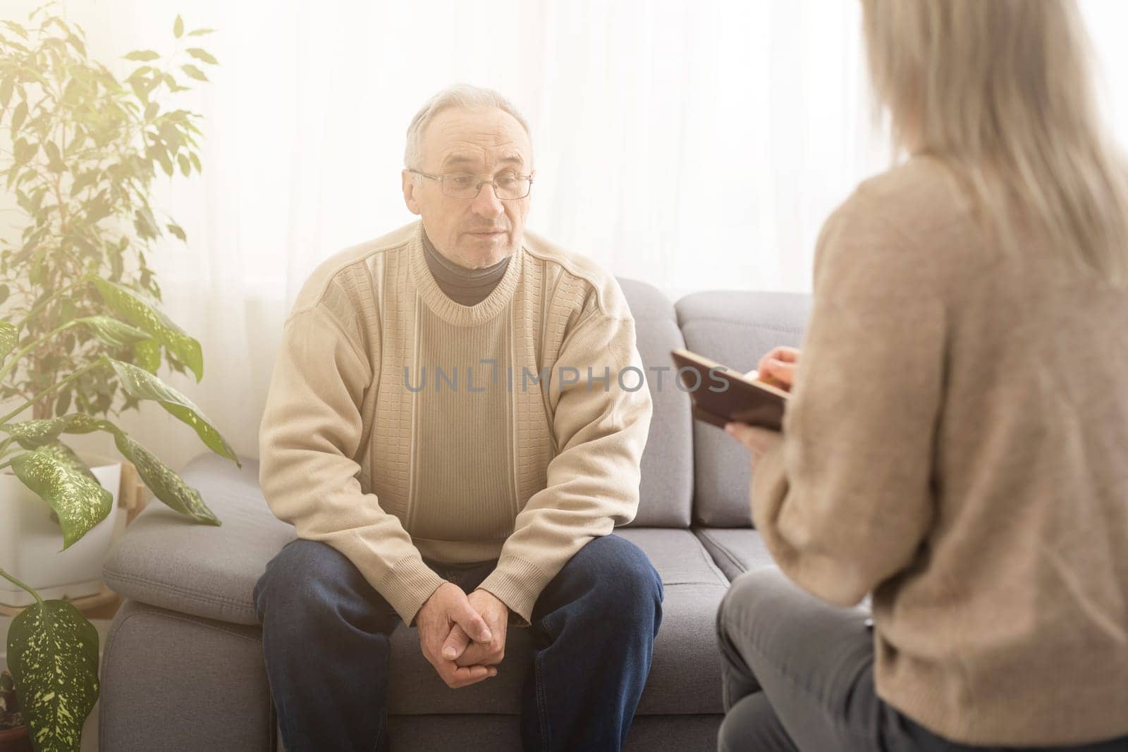 Caregiver psychologist console american senior people for mental health, geriatric psychology, Depressed senior man talking with female psychologist, desperate people, emotions sad, elderly worry by Andelov13