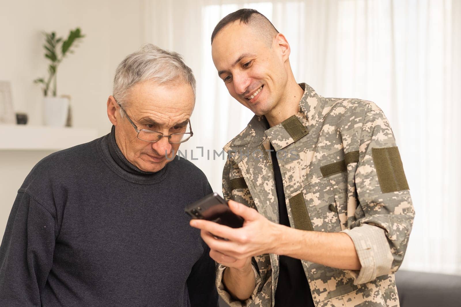 an elderly father and a military son.