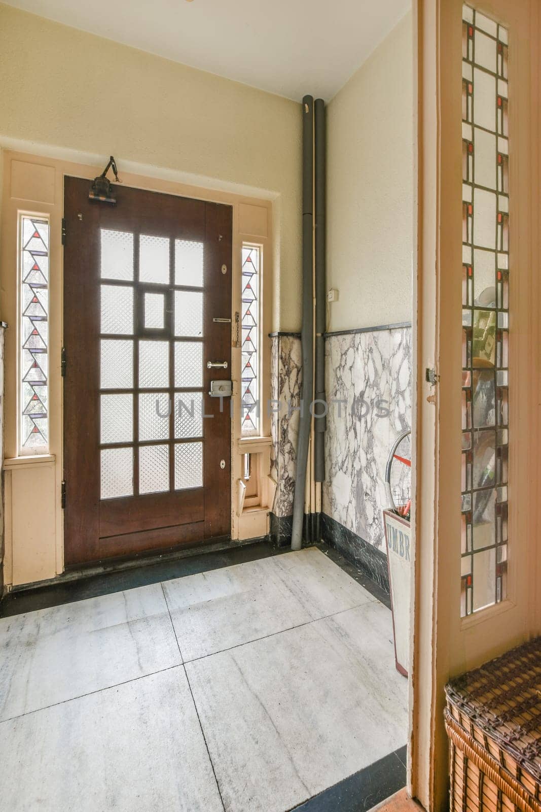 the entryway of a house with a wooden door by casamedia