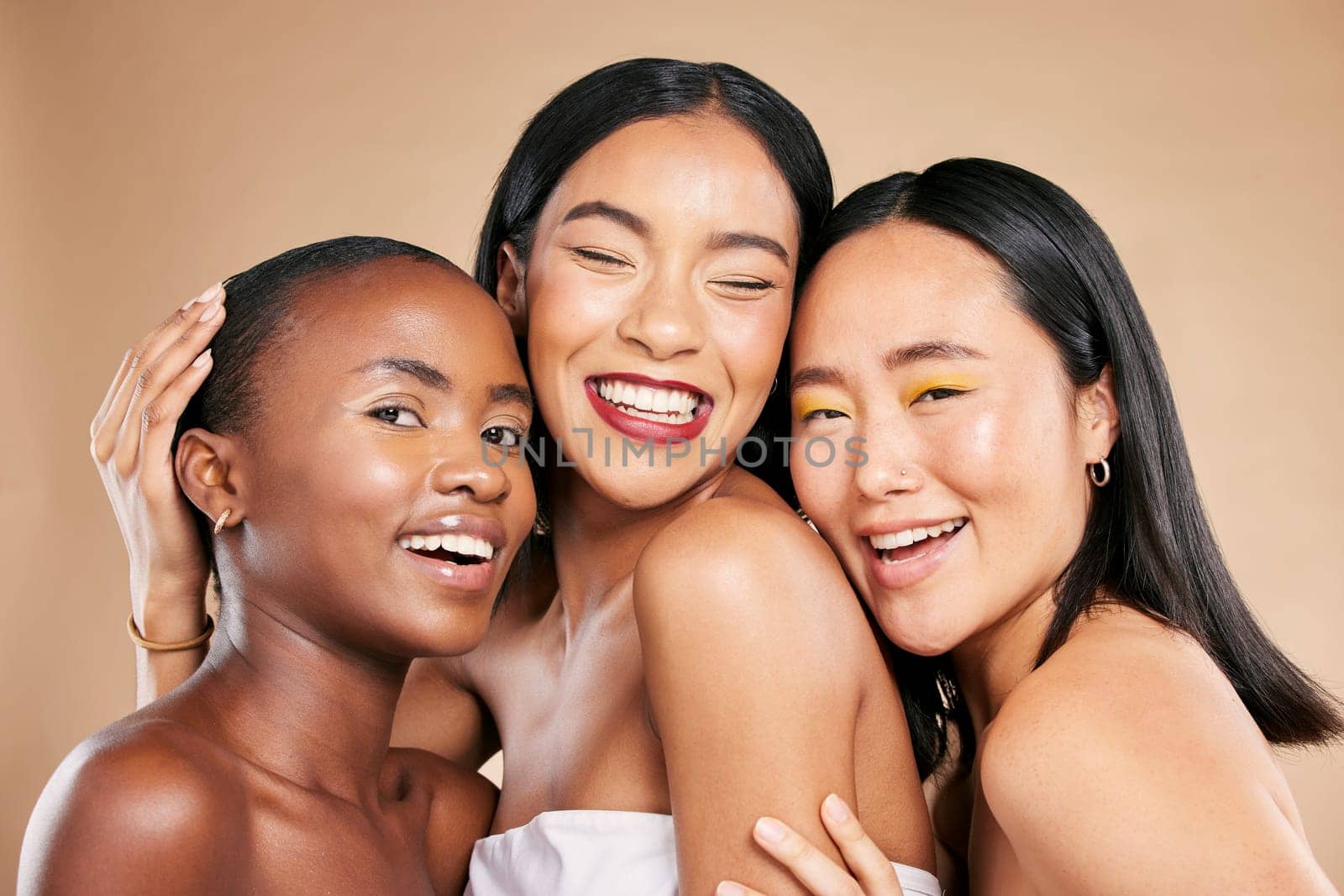 Happy women, portrait smile and hug in beauty for skincare, cosmetics or makeup against a studio background. People, friends or models smiling in happiness or satisfaction for fun healthy treatment.