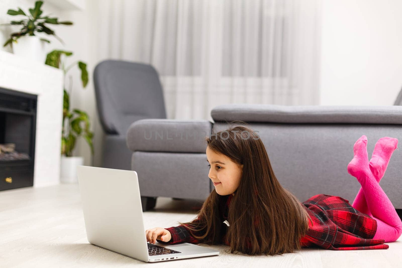 Happy little girl buying online at home, shopping online