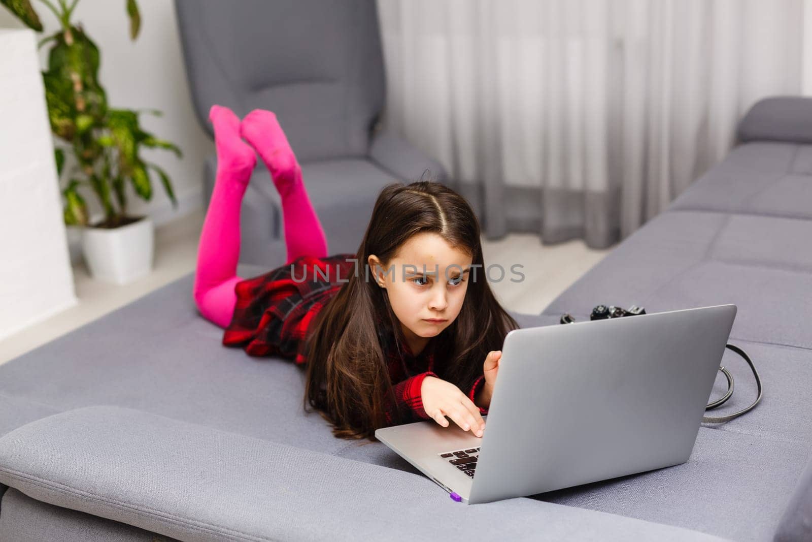 Happy little girl buying online at home, shopping online by Andelov13