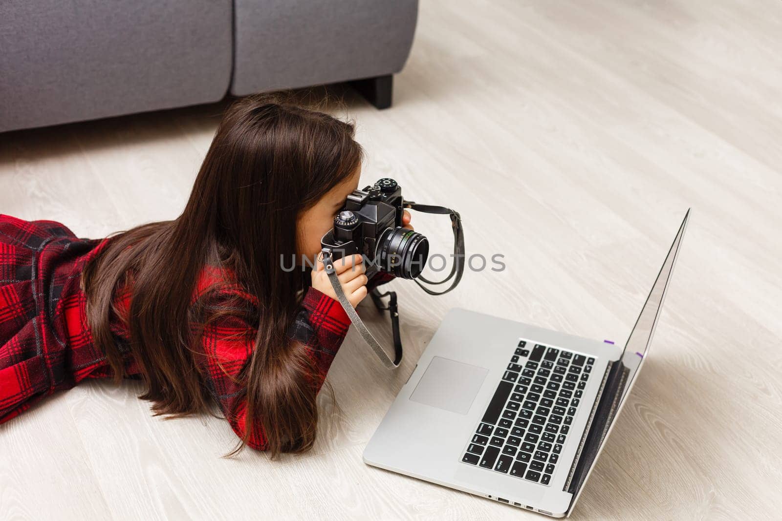 Little girl with daddy looking at pictures on computer