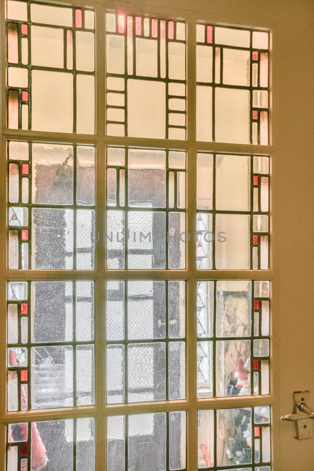 a view of a window from inside of a church by casamedia