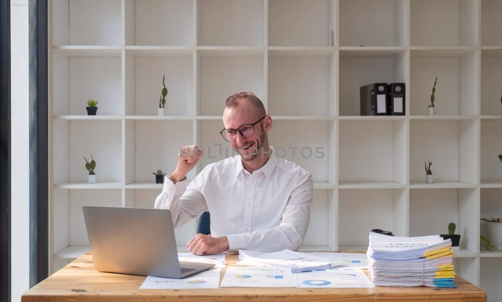 businessman happy excited in office on laptop read good news winner successful business success victory financial market growth concept.