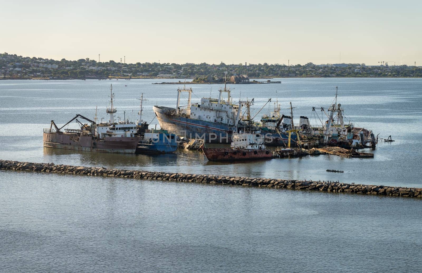 Abandoned ships rusting in shallow water in the harbor of Montevideo in Uruguay