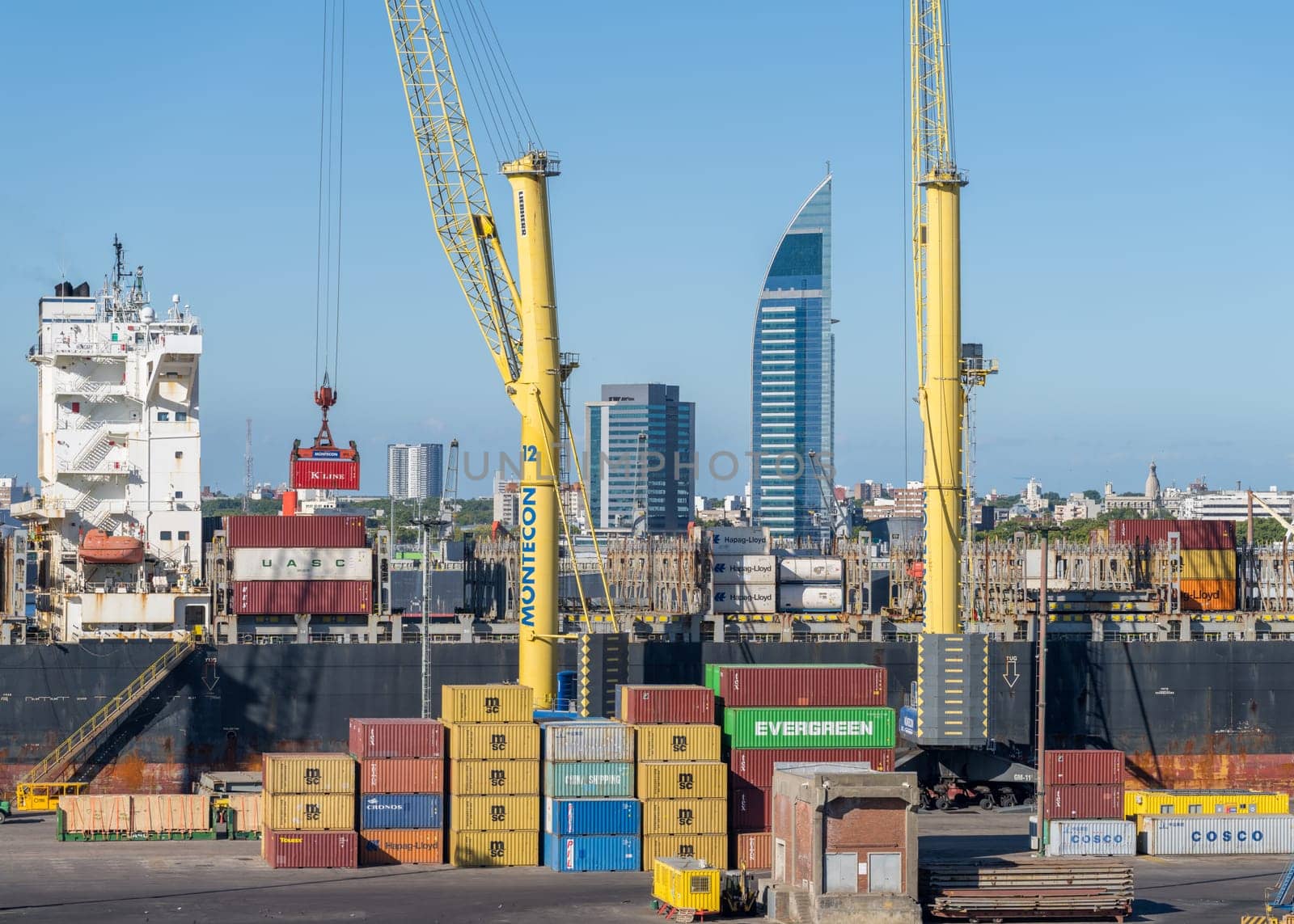 Montevideo, Uruguay - 5 February 2023: Containers being loaded onto ship in commercial port