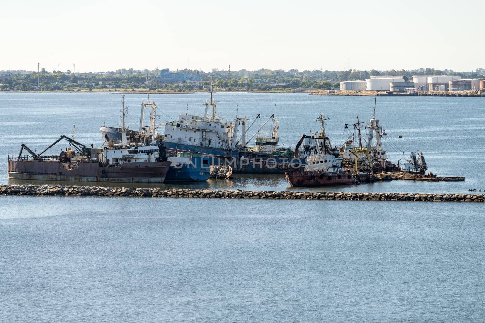 Montevideo, Uruguay - 5 February 2023:Abandoned ships rusting in shallow water in the harbor