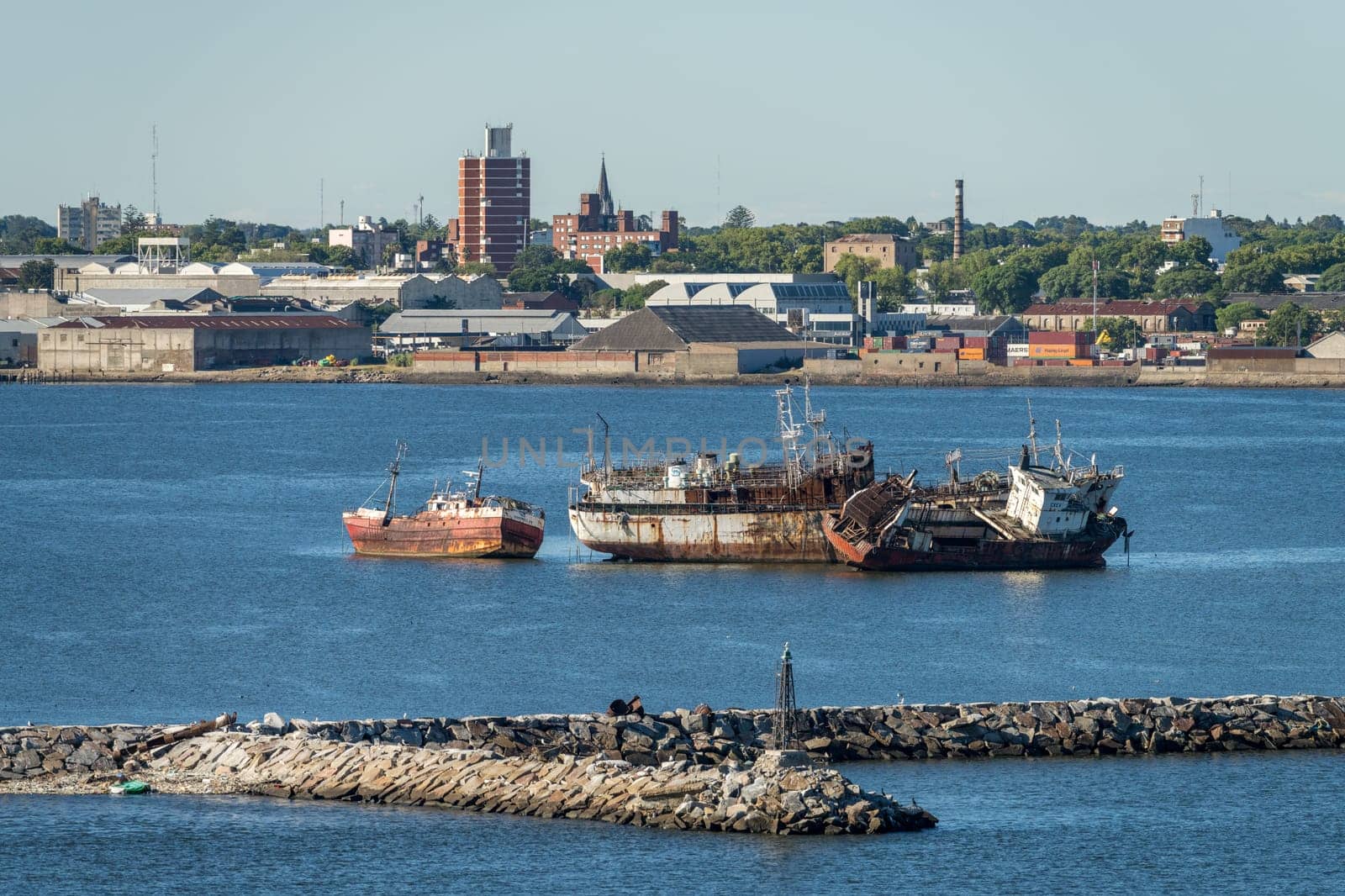 Montevideo, Uruguay - 5 February 2023:Abandoned ships rusting in shallow water in the harbor