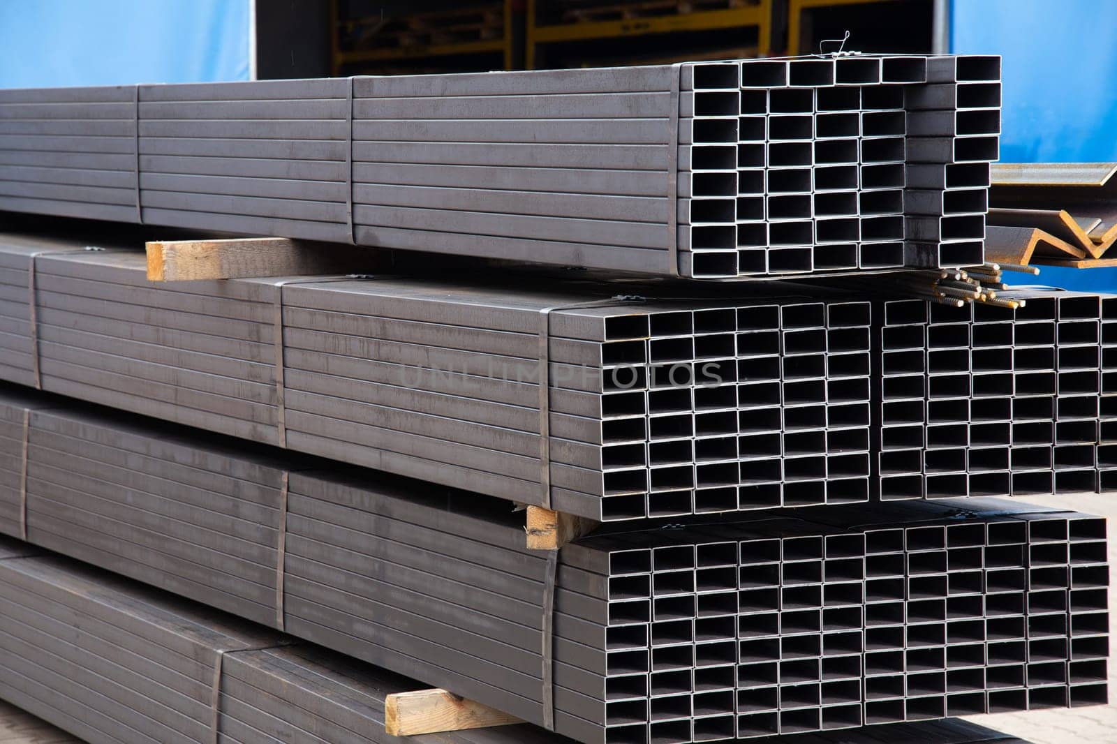 Metal profile pipe of rectangular cross section in packs at the warehouse of metal products