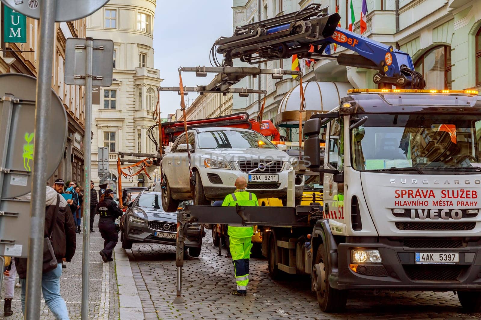 11 November 2022 Prague, Czech Republic. Two cars are taken away by a tow truck, improper parking in the city center. Parking inspection.