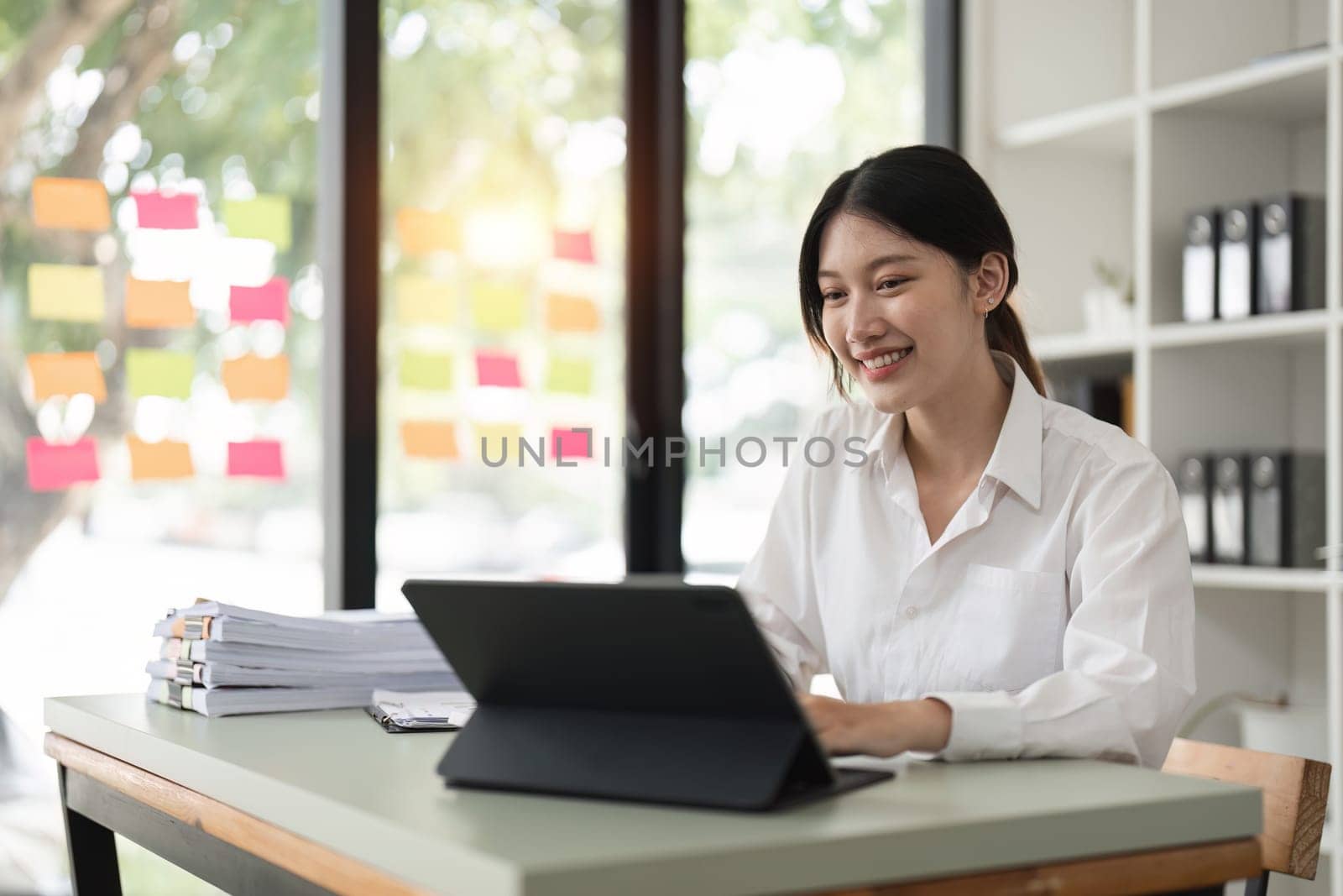 Accountant woman working on laptop and do document, tax, exchange, accounting and Financial advisor concept by nateemee