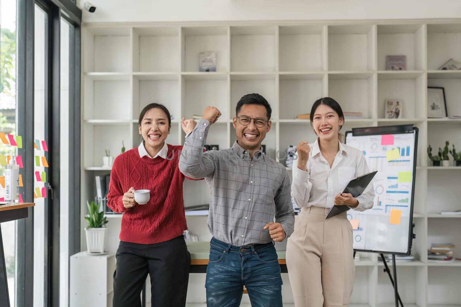 Group of successful multiethnic young business asian team in office.