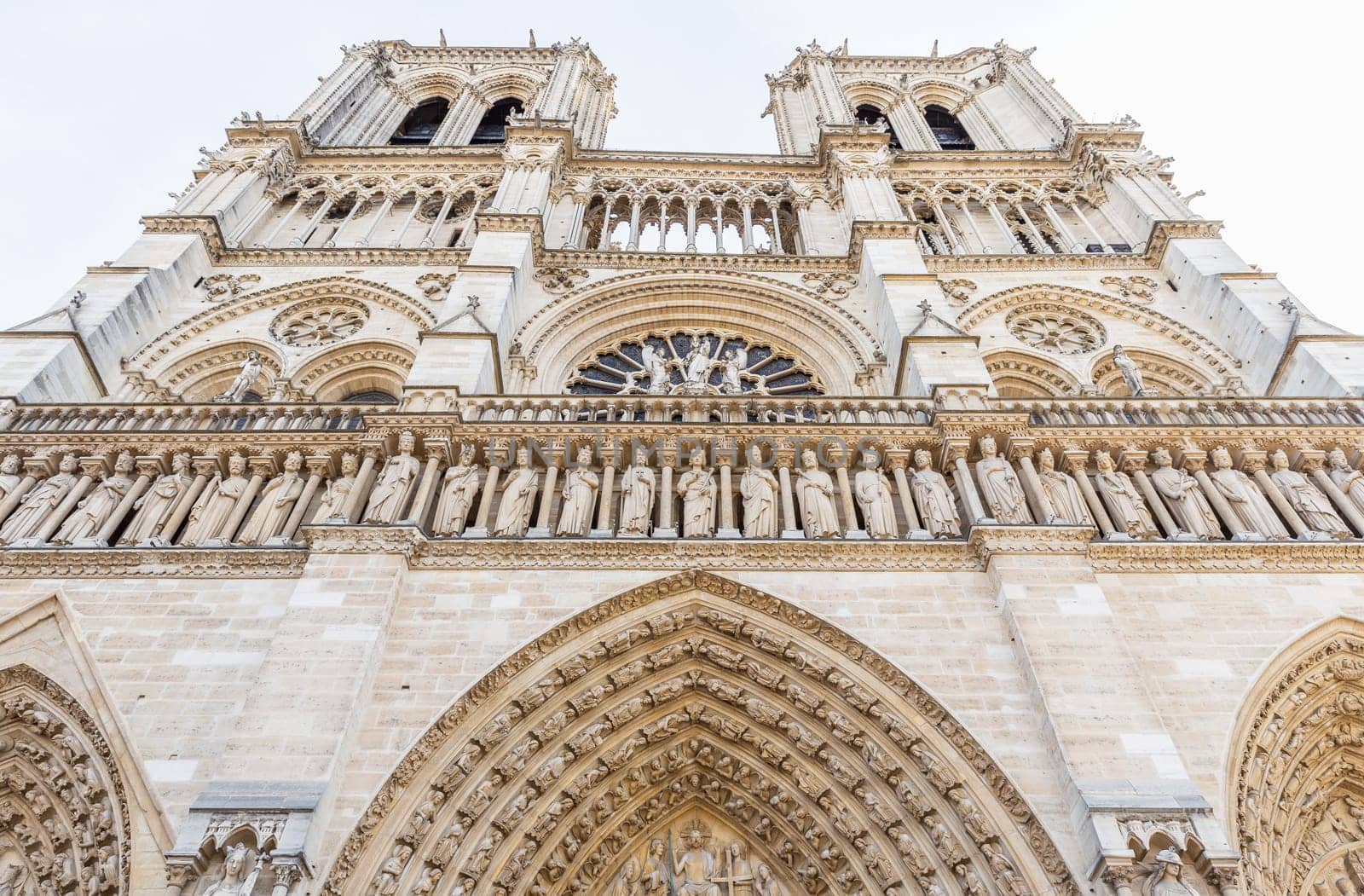 Paris, France - September 29, 2018: The front side of Notre-Dame building, the famous medieval Catholic cathedral.