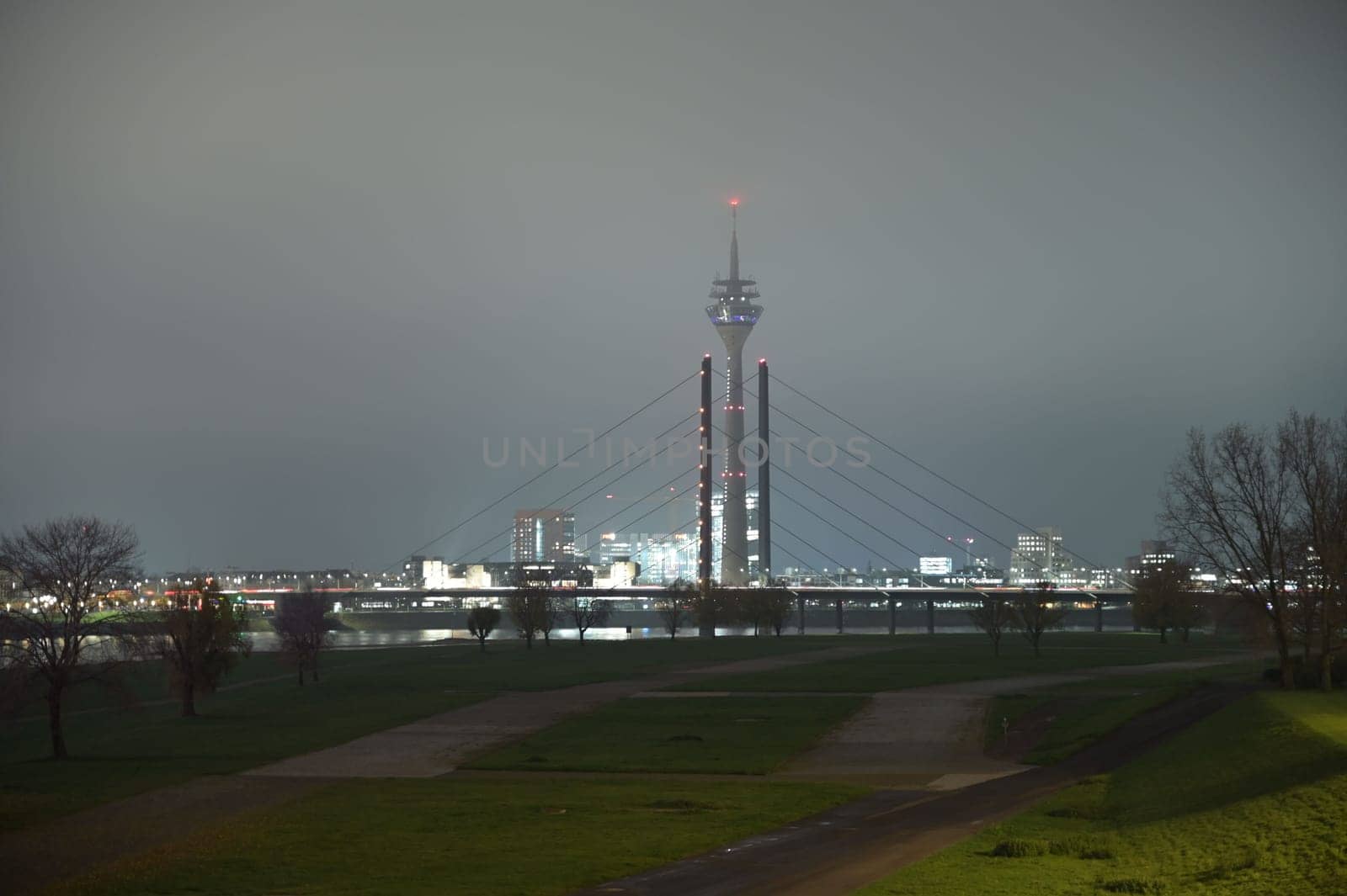 TV Tower and Theodor Heuss bridge at night and fog in Duesseldorf, Germany