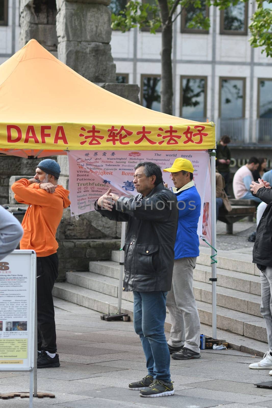 Vertical shot of people demonstrating in Cologne against organ trafficking of Falun Gong members