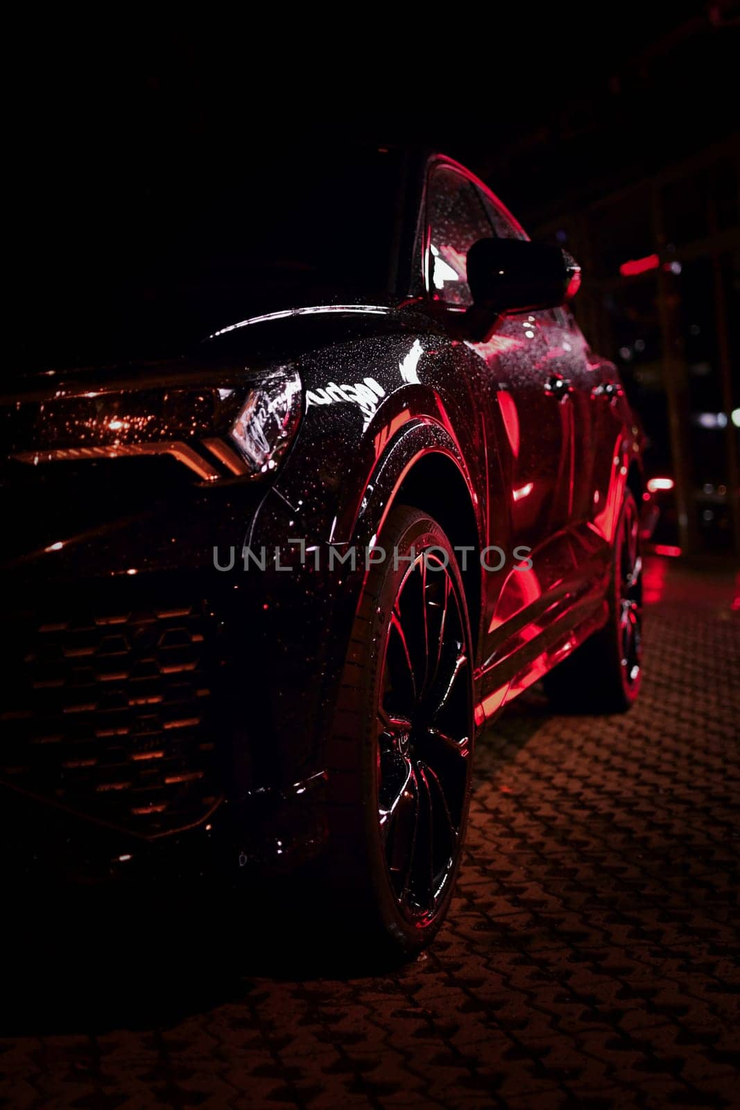 Light reflected in black SUV at night