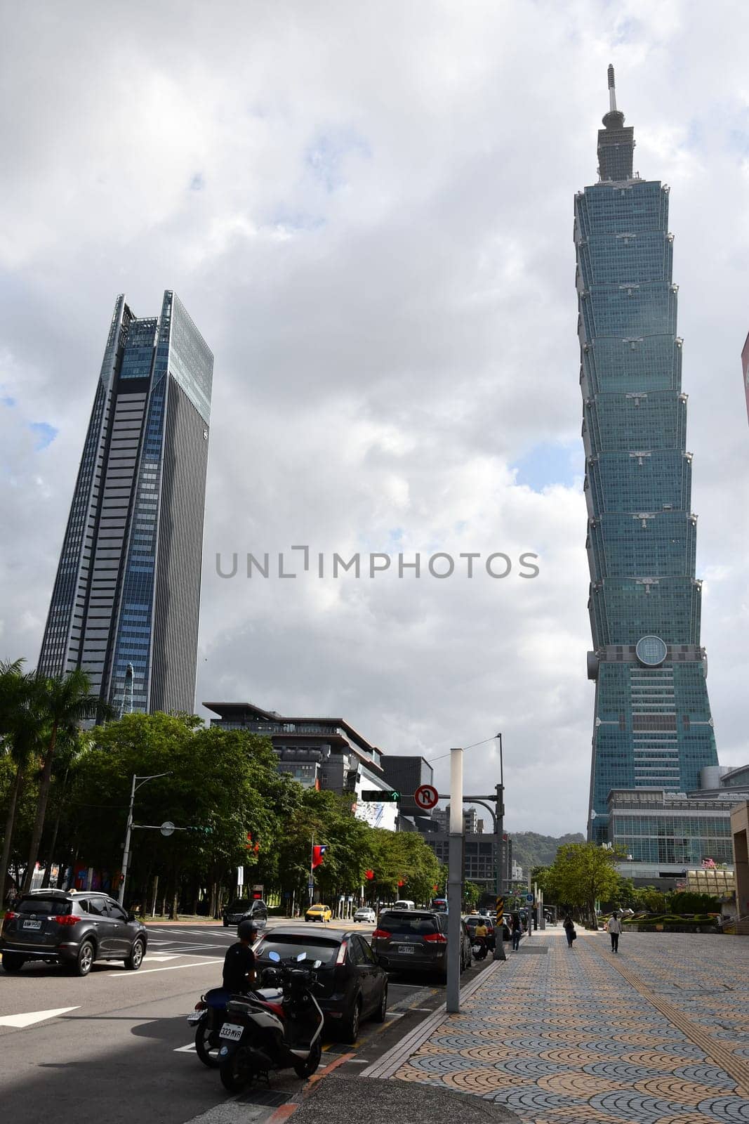 Taipei Nan Shan Plaza and Taipei 101 skyscrapers against a cloudy sky
