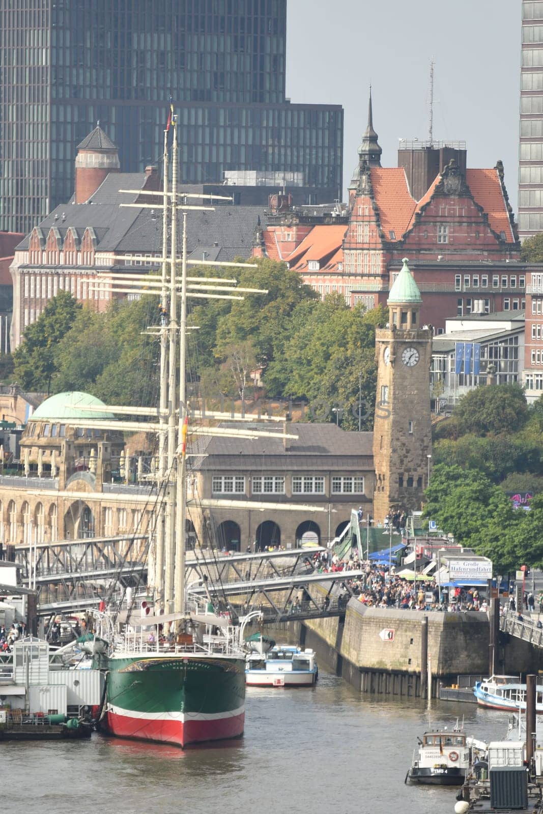 Scenic shot of harbour with an old ship and Hamburg architecture in Hamburg, Germany