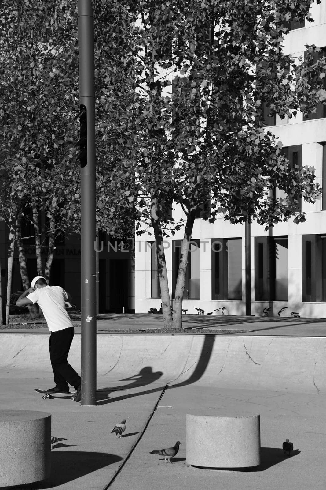 Skater in white shirt in front of the theater in Dsseldorf, Germany