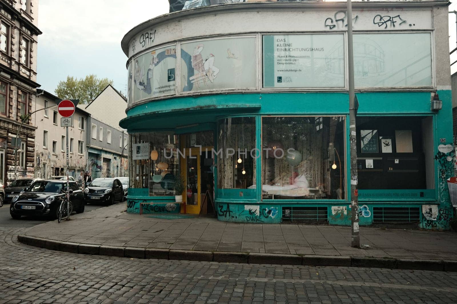 Turquoise house with glass facade in Hamburg, Germany