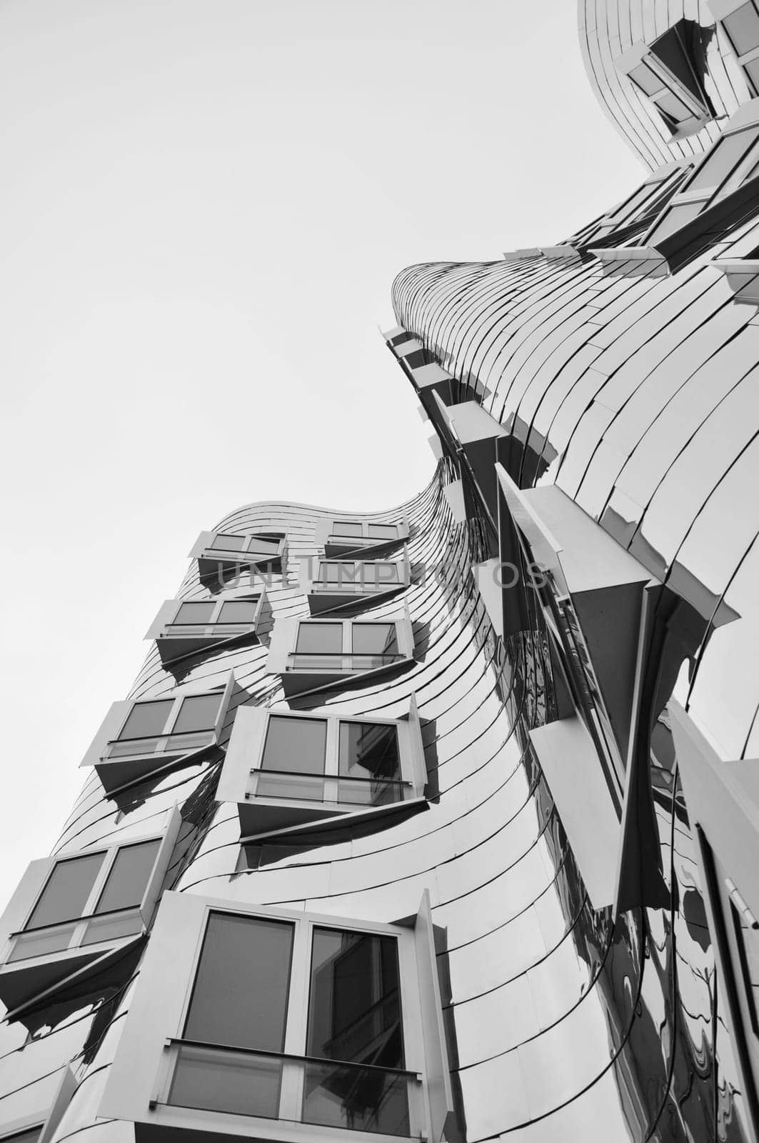 Mirrored metal facade of the Gehry buildings at the Media Harbour in Dusseldorf, Germany