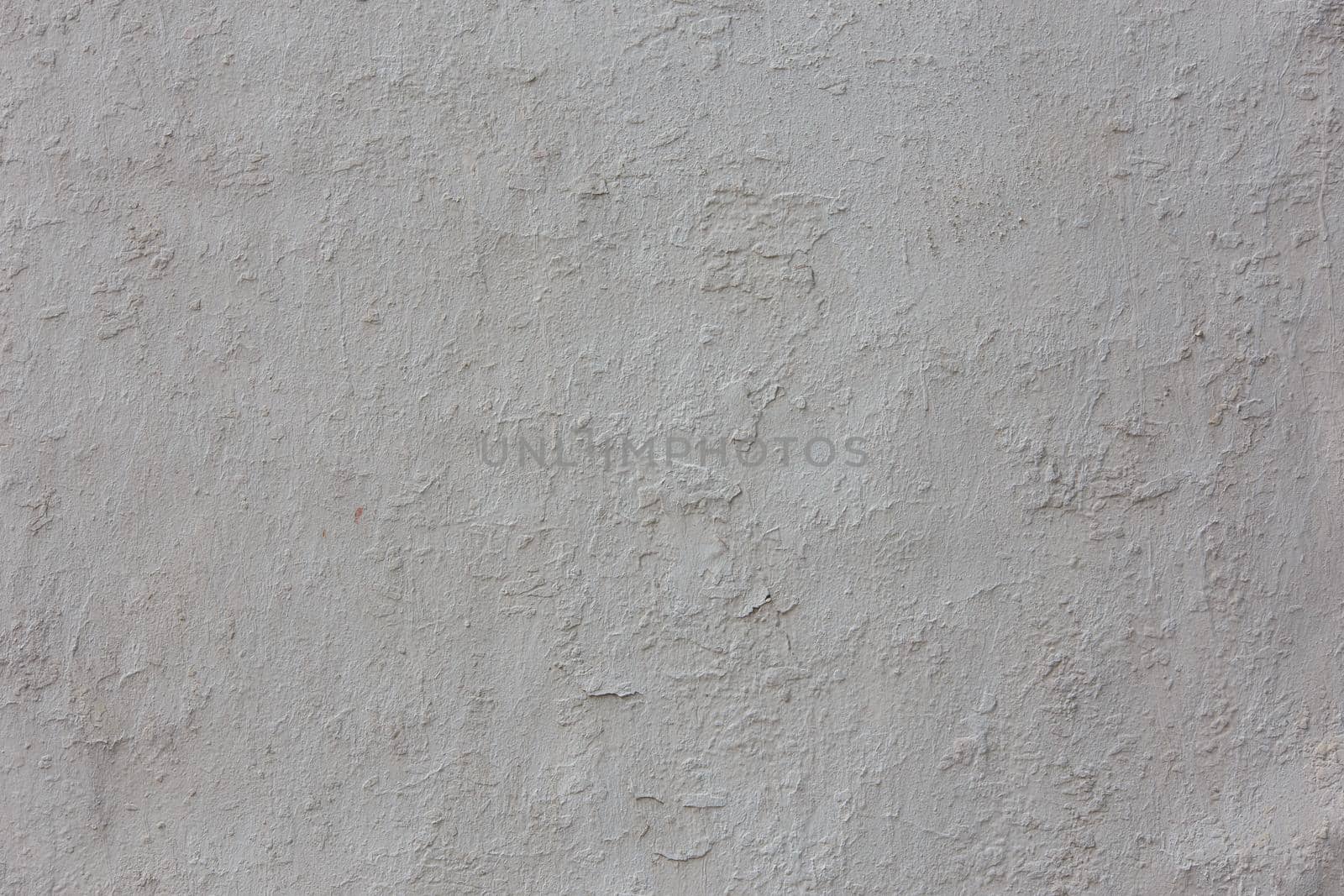 shabby dry white plaster under direct sunlight texture and full frame background