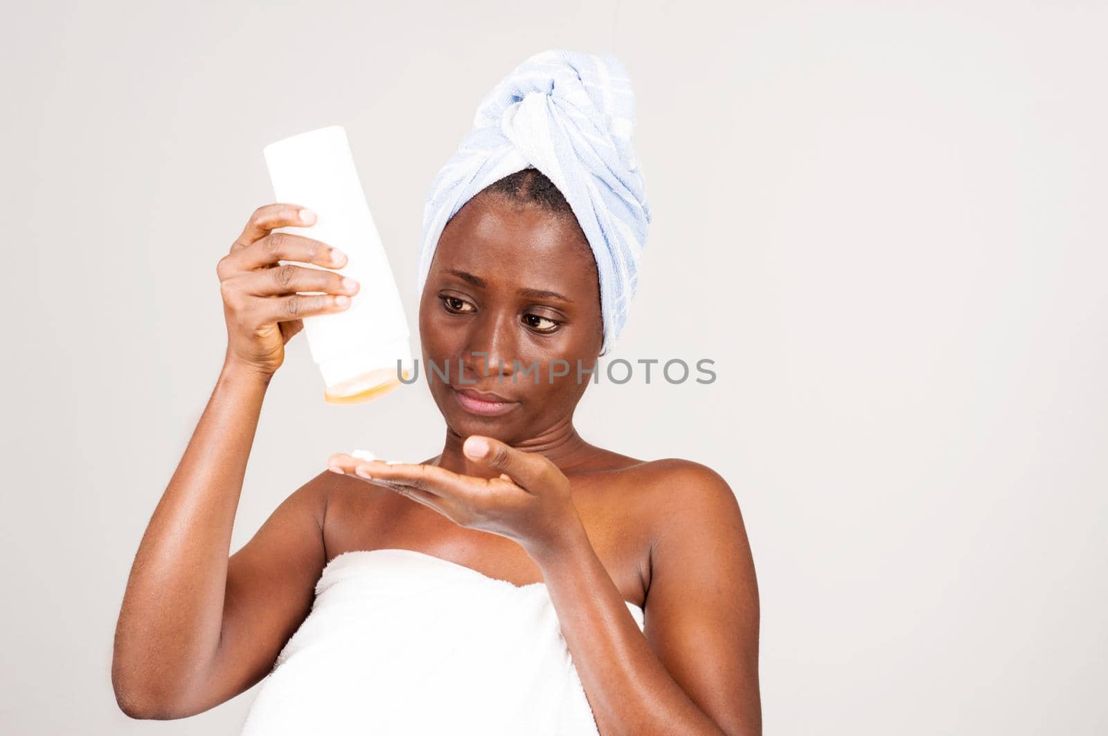 beautiful african woman with a tube of ointment. by vystek