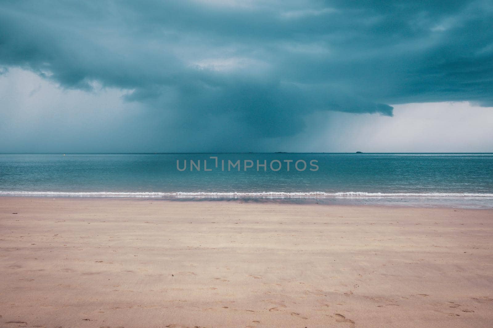 Unsettled dark sky over the beach in Brittany, France