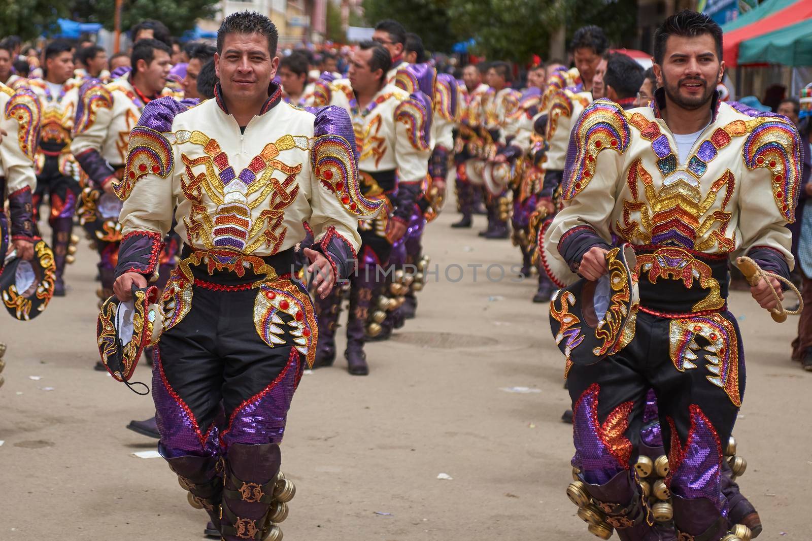 Oruro, Bolivia - February 26, 2017: Caporales dancers in ornate costumes performing as they parade through the mining city of Oruro on the Altiplano of Bolivia during the annual carnival.