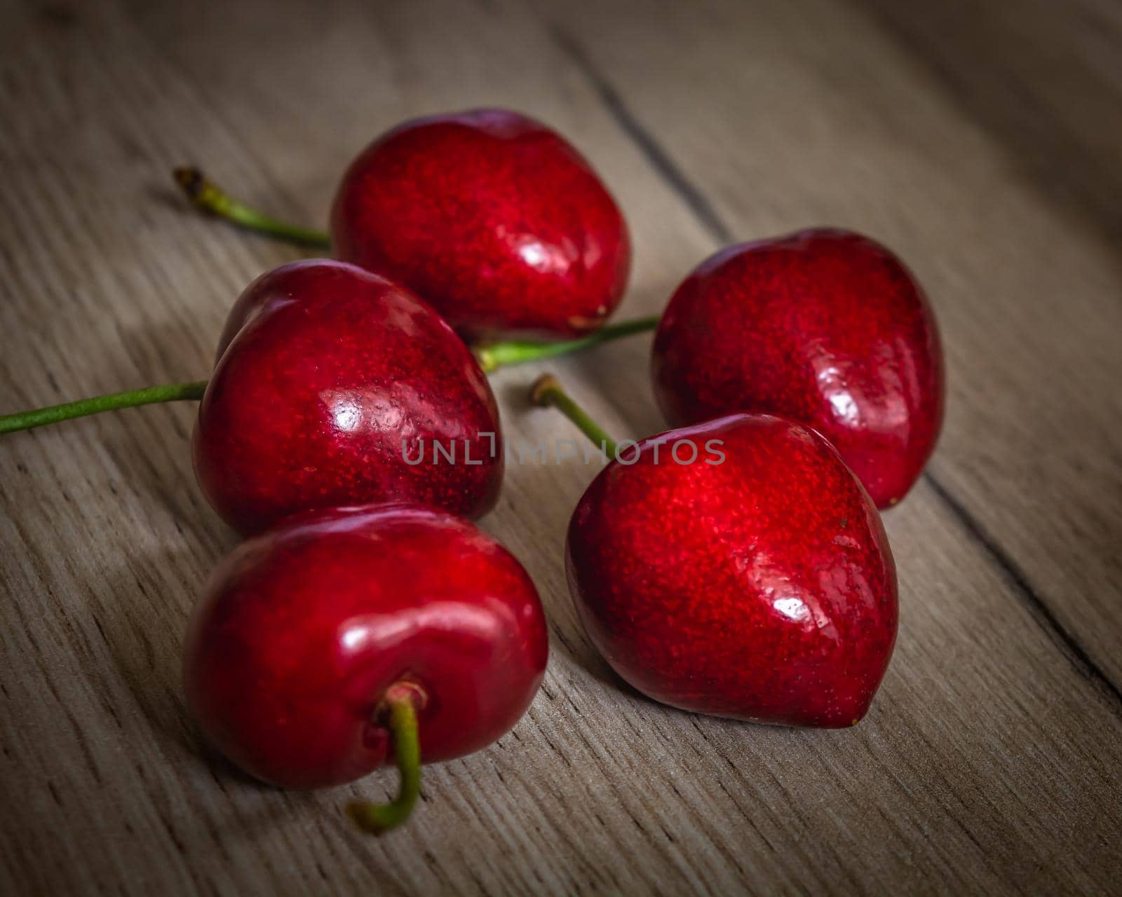 Set of five fresh red cherry fruits, close-up photo of healthy sweet food