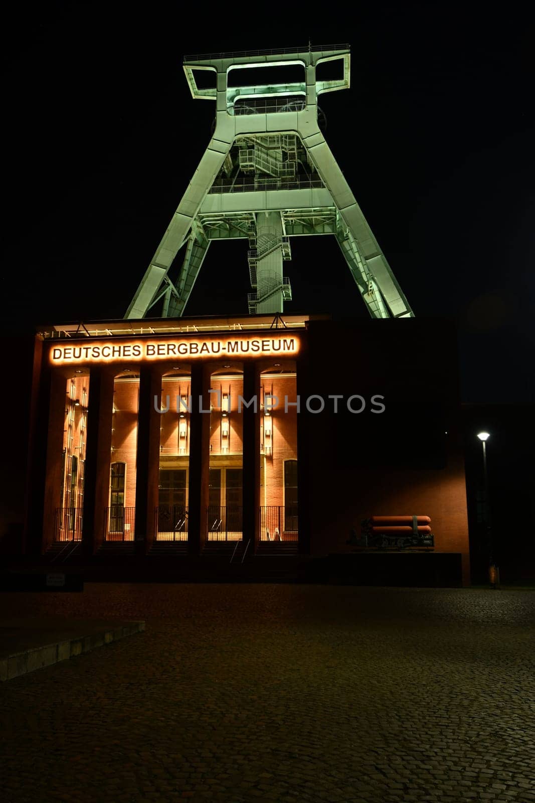 Entrance of the German Mining Museum in Bochum with an old winding tower in the background