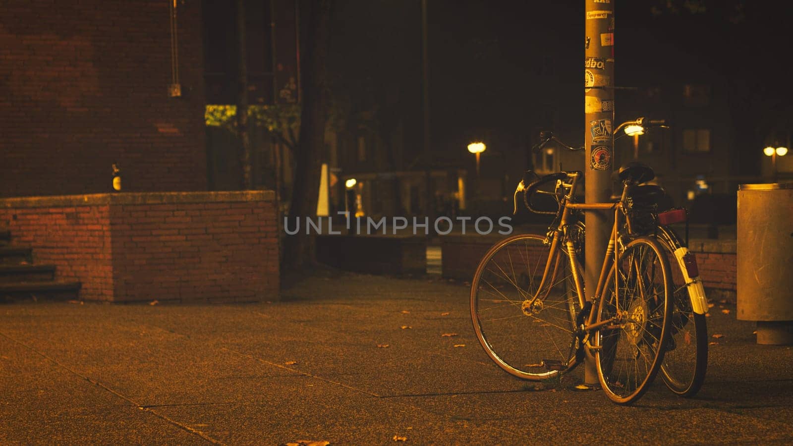 Old bicycles in lantern light in front of the Bochum Schauspielhaus, Germany