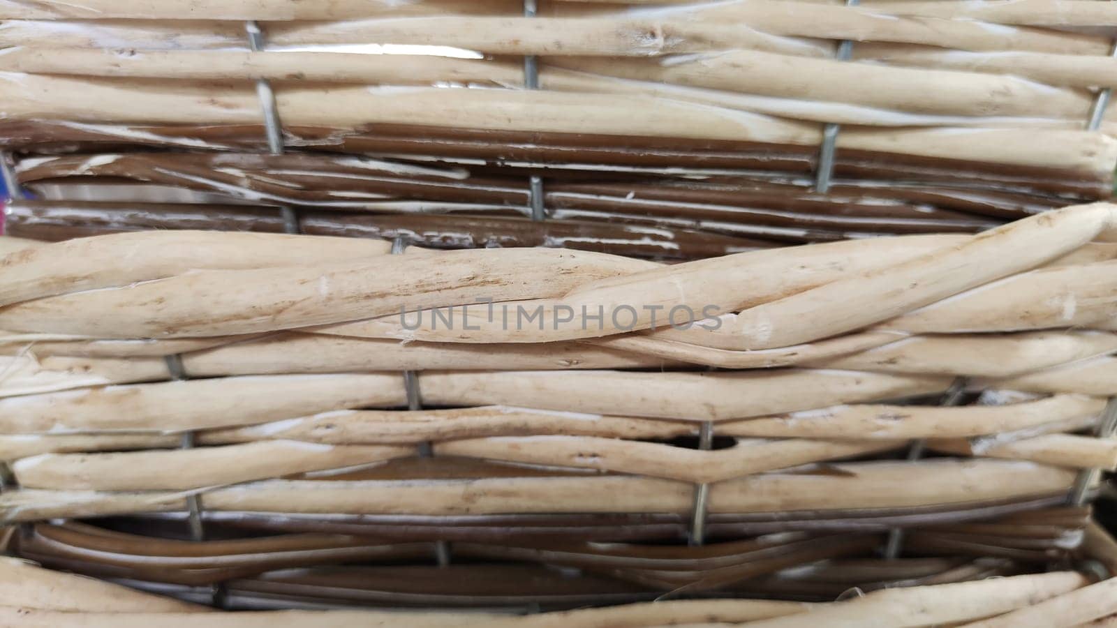 Texture of basket surface. Pattern background. Wooden Vine Wicker straw Basket. handcraft weave texture natural wicker, texture basket, Natural rattan. Detail of a curved basket weave surface by keleny