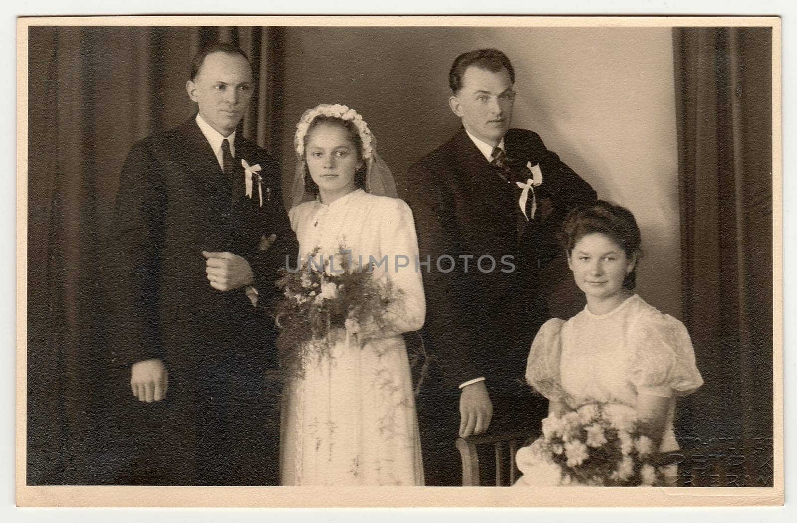 PRIBRAM, THE CZECHOSLOVAK REPUBLIC - FEBRUARY 22, 1941: Vintage photo of newlyweds (two couples)