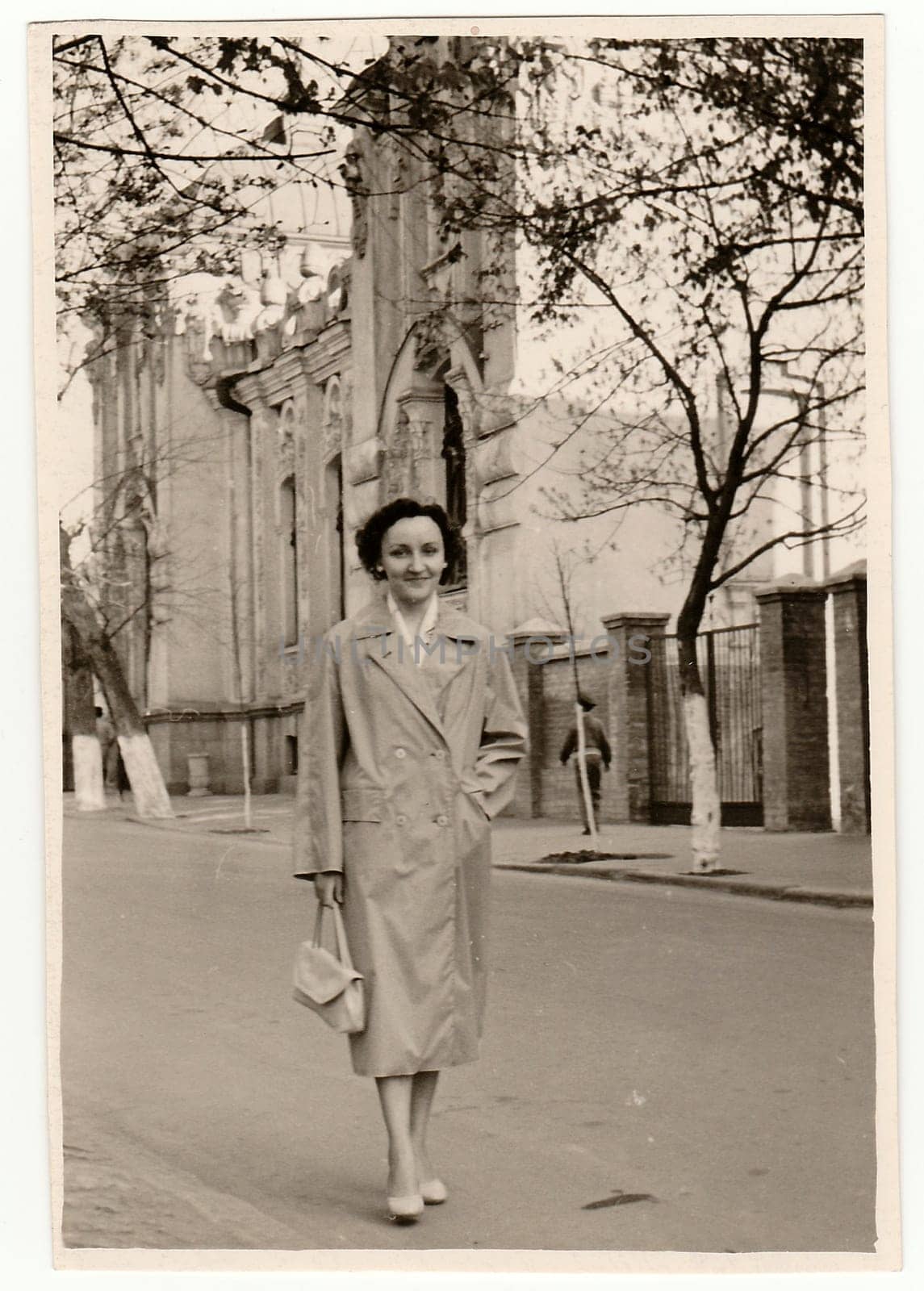 USSR - APRIL, 1961: Vintage photo shows a young pretty woman on the street in USSR.