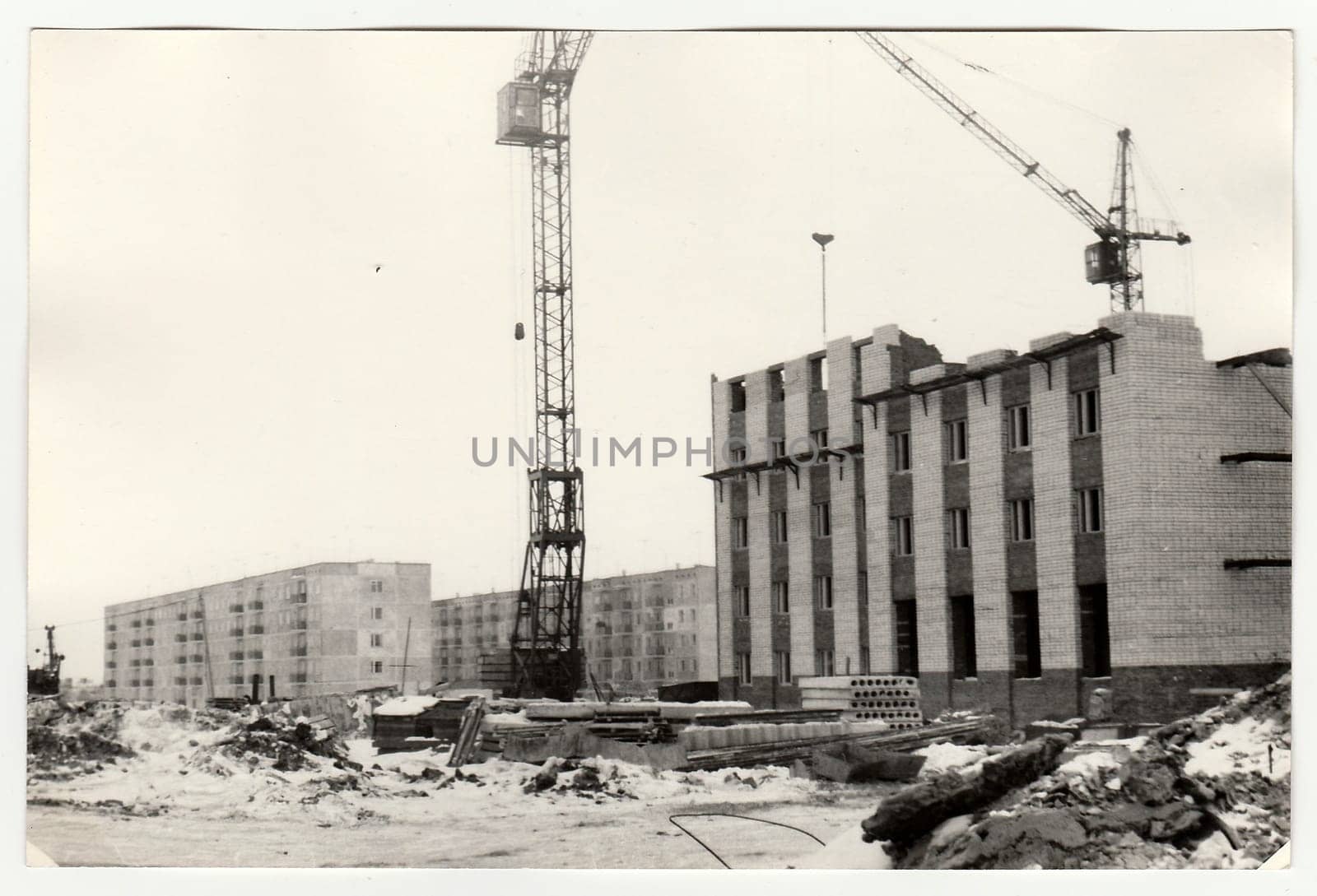 Vintage photo shows construction of blocks of flats in USSR. Winter time. by roman_nerud