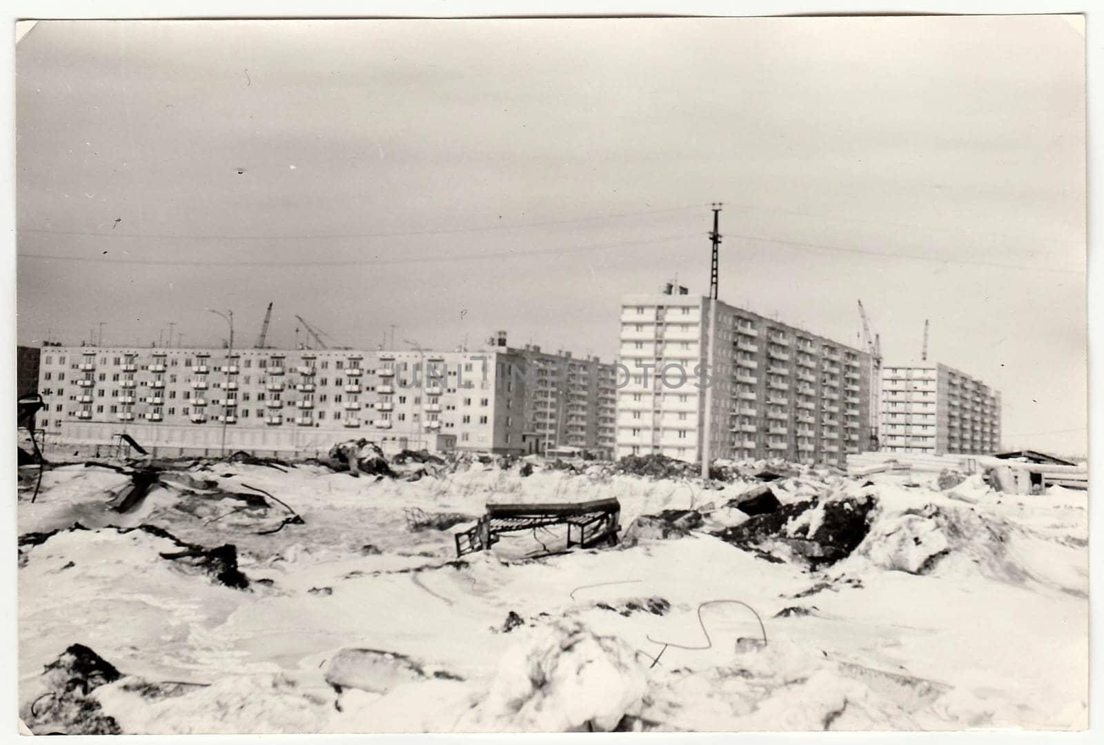 Vintage photo shows construction of blocks of flats in USSR. Winter time. by roman_nerud