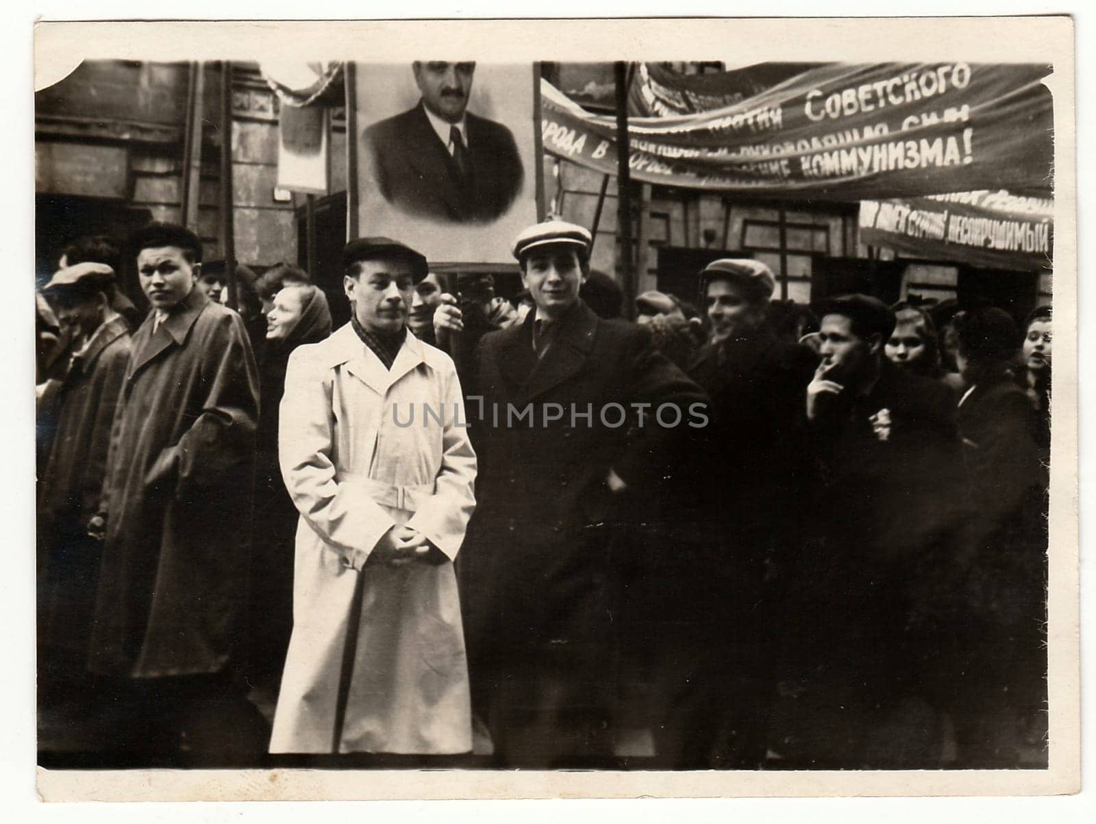 Vintage photo shows people celebrate May Day (International Workers' Day). by roman_nerud