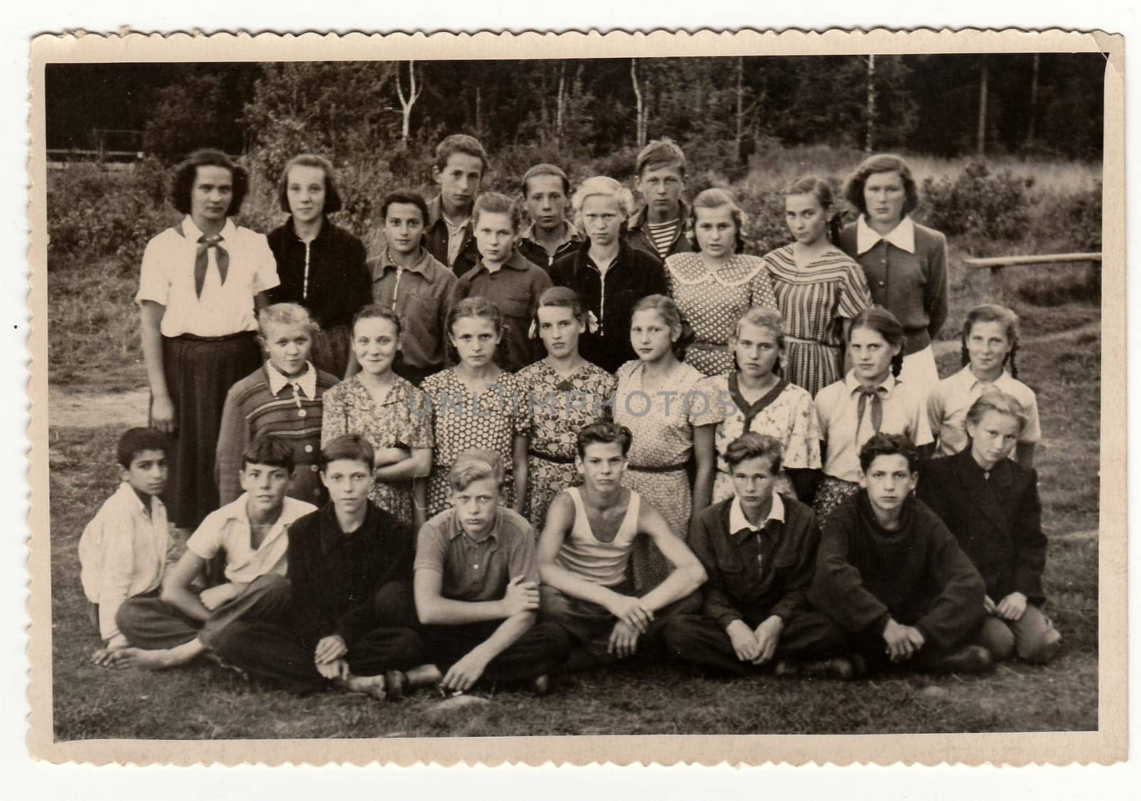 Vintage photo shows teenagers and female chiefs at summer camp. by roman_nerud